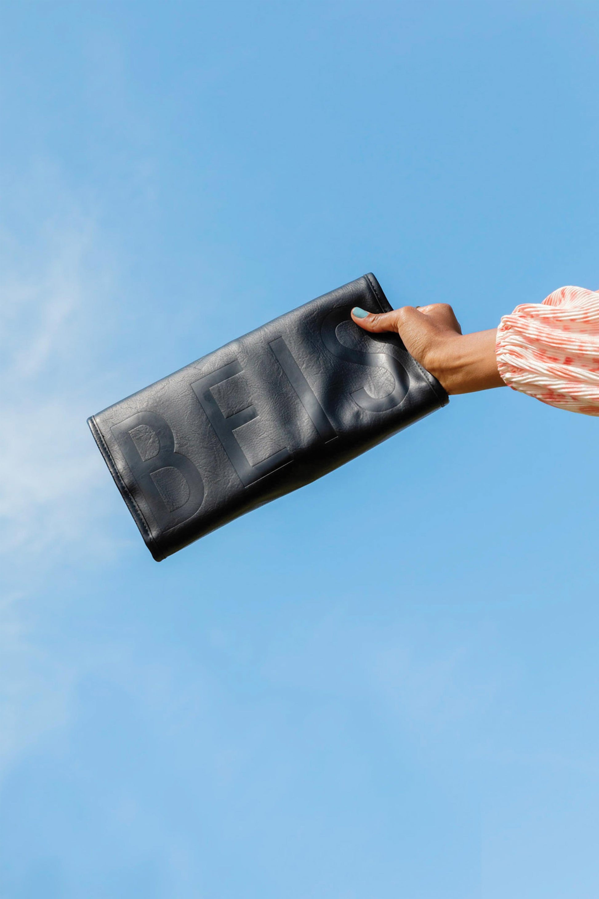 hanging jewelry case, with sky background