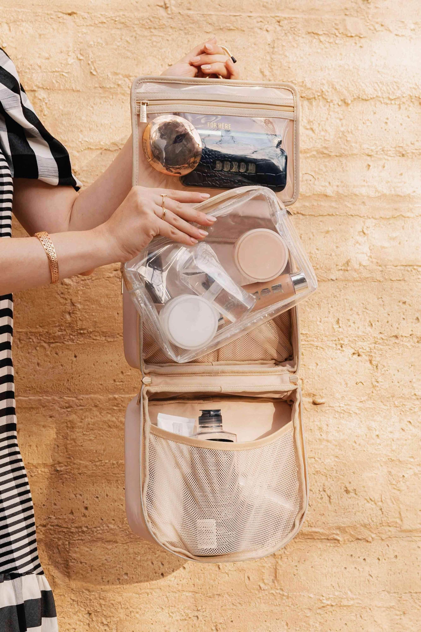 hanging cosmetic case with beauty products