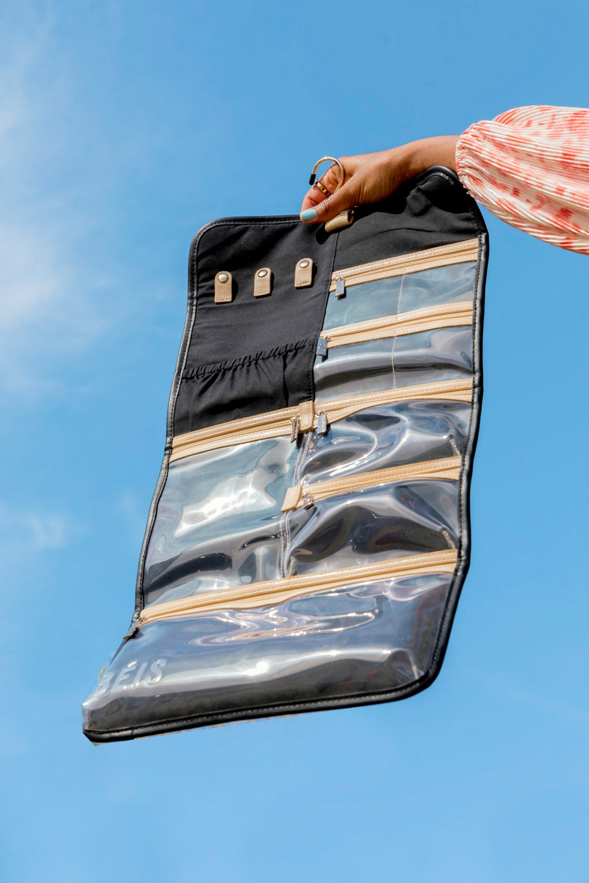 Hanging Jewelry Case Black Open Pockets Model Hand Blue Sky