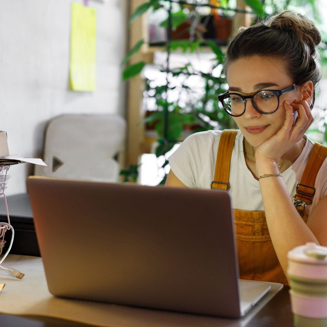 Young woman working remotely from her laptop