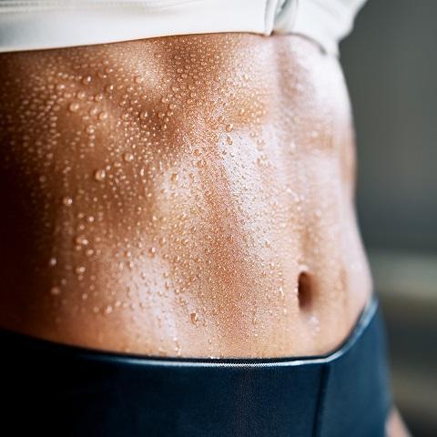 Sweaty torso of a girl in the gym