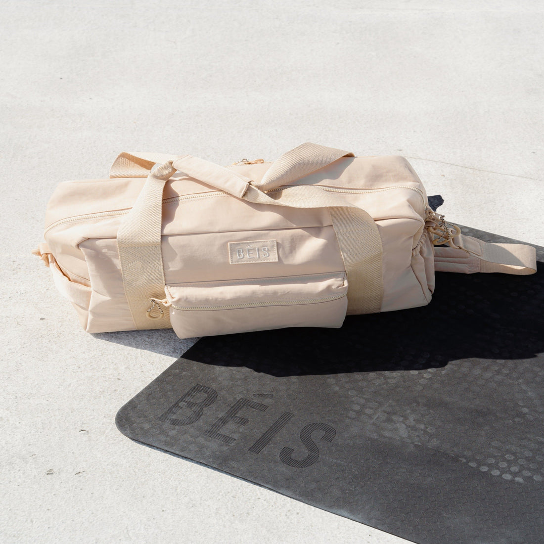 White gym bag on yoga mat