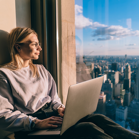 youthful Caucasian blogger using netbook device for social communication