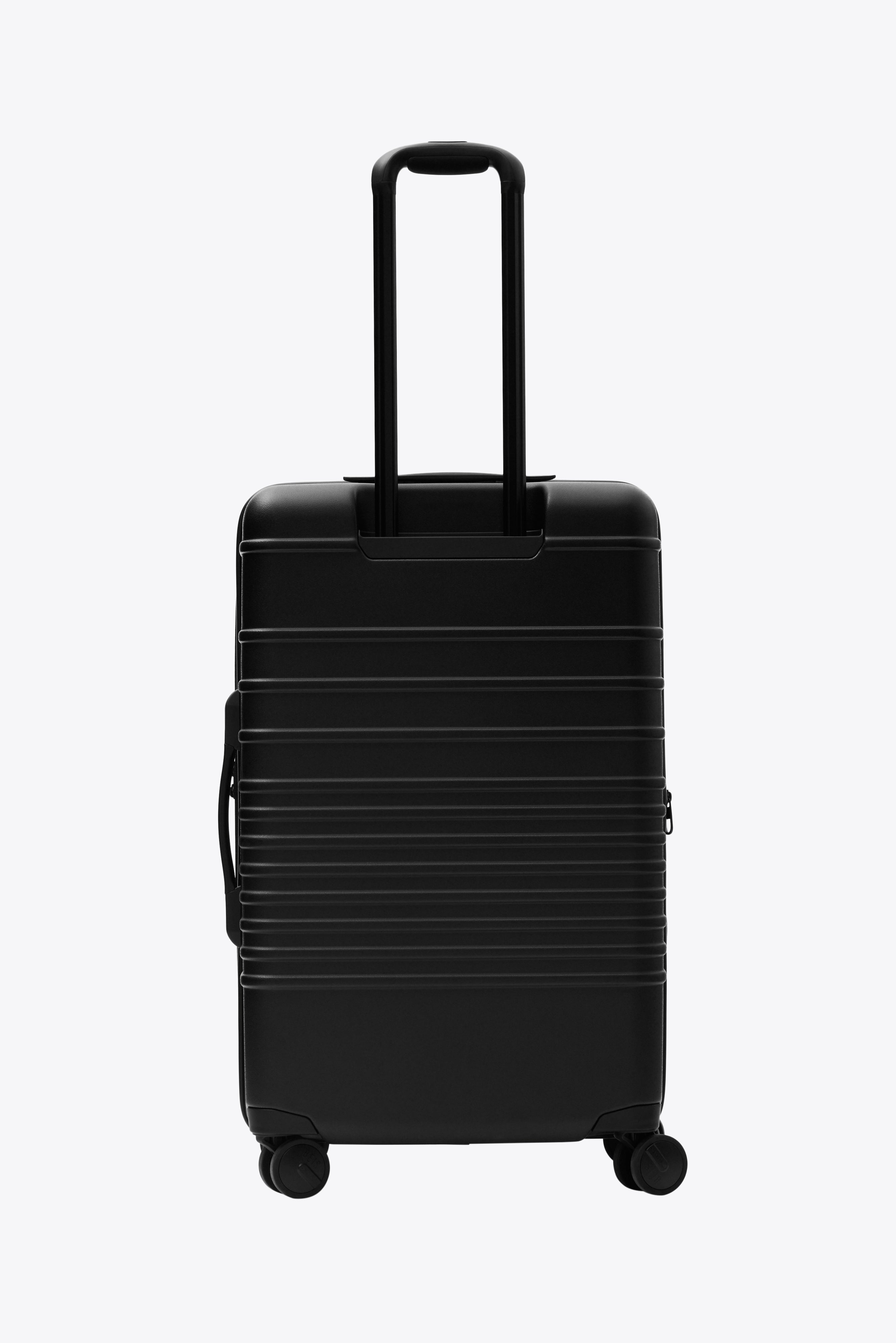 Plain black suitcase on sale