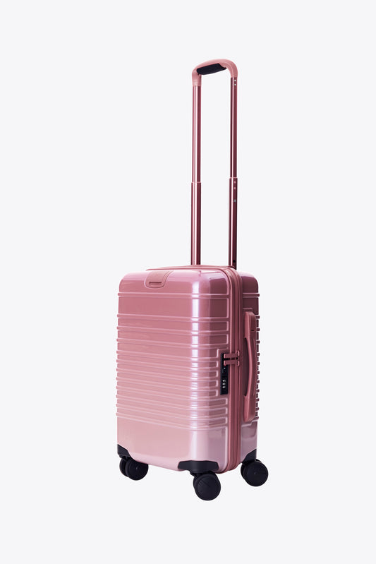 The Small Carry-On Roller in Wicked Pink