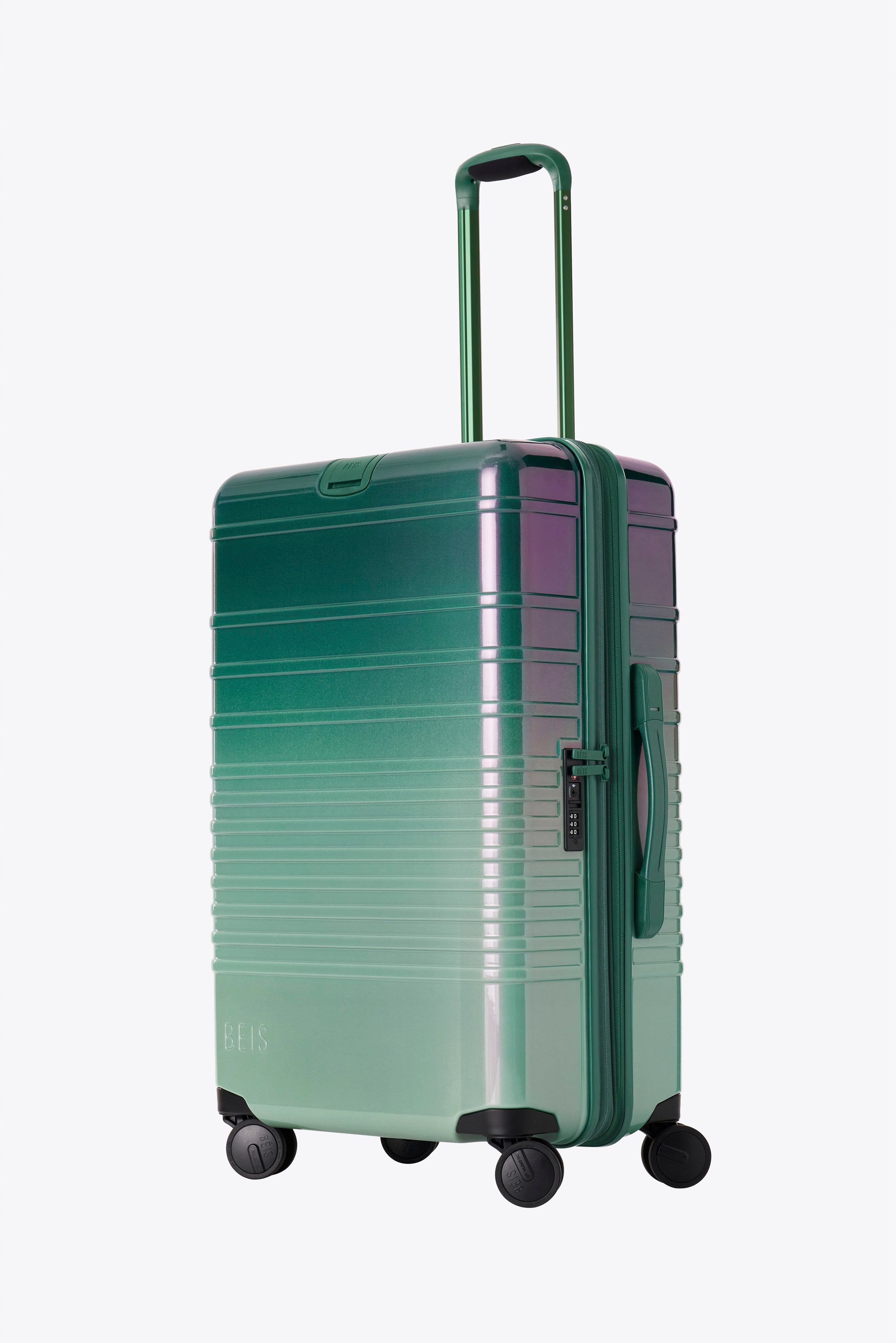 Pink and green luggage with wheels online